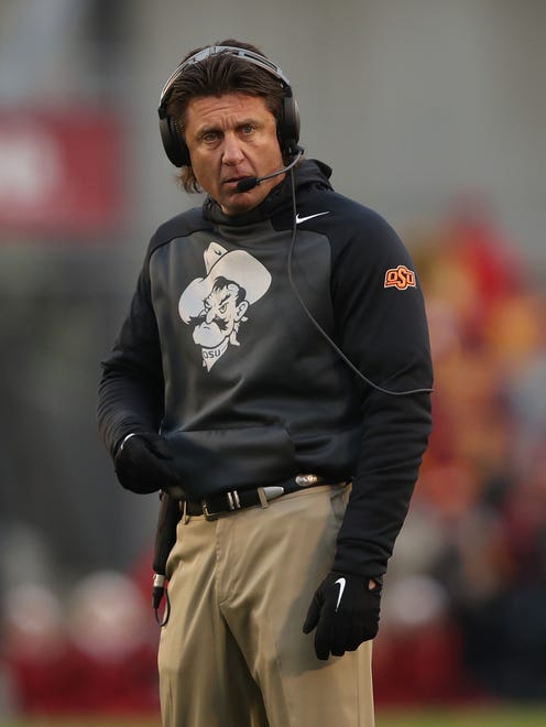 Oklahoma State coach coach Mike Gundy watches his team against Iowa State.