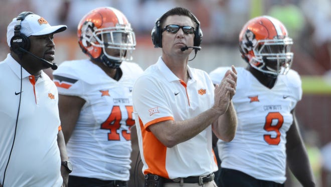 Brendan Maloney, USA TODAY Sports
Oklahoma State coach Mike Gundy says once kickoff comes, the Cowboys try to avoid the emotions that accompany senior day.
Sep 26, 2015; Austin, TX, USA; Oklahoma State Cowboys head coach Mike Gundy reacts against the Texas Longhorns during the second quarter at Darrell K Royal-Texas Memorial Stadium on Sept. 26, 2015.