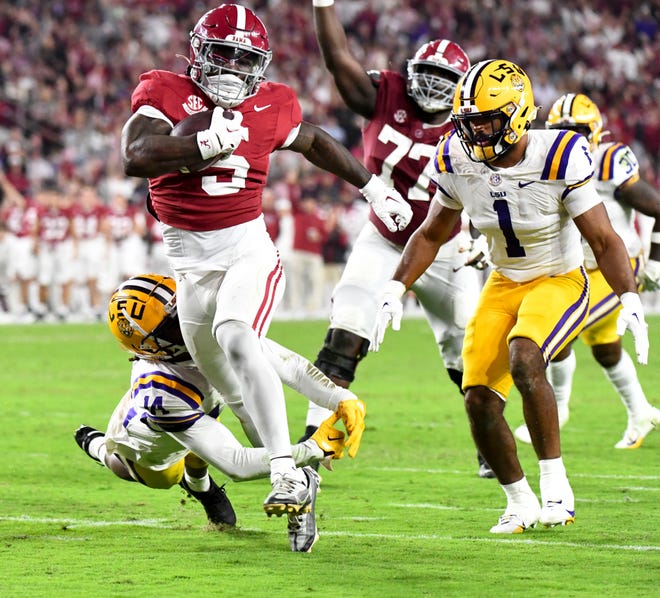 Nov 4, 2023; Tuscaloosa, Alabama, USA; LSU Tigers safety Andre' Sam (14) and LSU Tigers linebacker Omar Speights (1) cannot catch Alabama Crimson Tide running back Roydell Williams (5) as he runs for a touchdown at Bryant-Denny Stadium. Alabama defeated LSU 42-28. Mandatory Credit: Gary Cosby Jr.-USA TODAY Sports