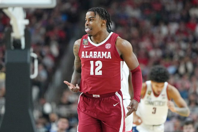 Apr 6, 2024; Glendale, AZ, USA; Alabama Crimson Tide guard Latrell Wrightsell Jr. (12) reacts after making a three point basket against the Connecticut Huskies during the first half in the semifinals of the men's Final Four of the 2024 NCAA Tournament at State Farm Stadium. Mandatory Credit: Bob Donnan-USA TODAY Sports