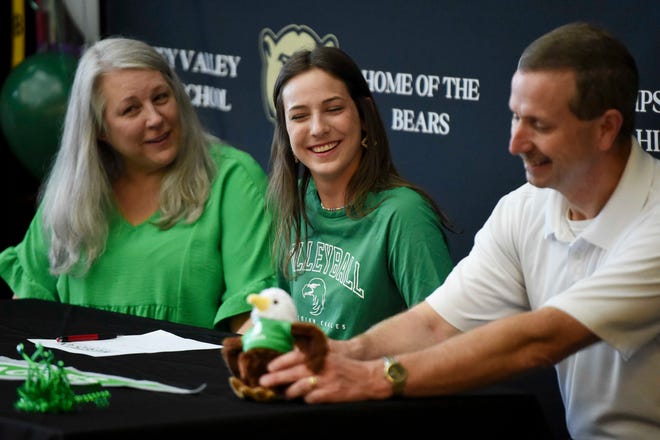 April 18, 2024; Tuscaloosa, AL, USA; Lillie Pate celebrates her signing day at Sipsey Valley High. Pate will play volleyball at Meridian Community College. Pate signs with her mother Appi and father Mike at her side.