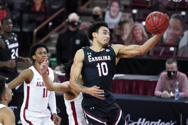 South Carolina forward Justin Minaya (10) drives to the hoop during the first half of an NCAA college basketball game against Alabama Tuesday, Feb. 9, 2021, in Columbia, S.C. (AP Photo/Sean Rayford)