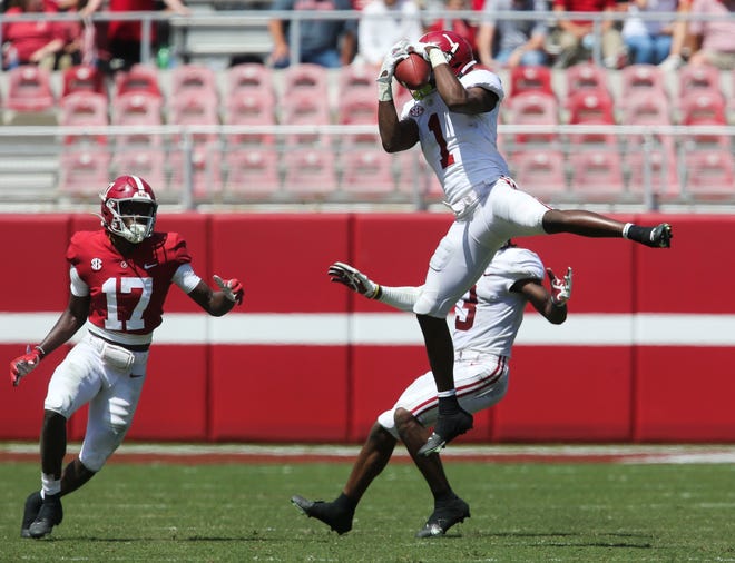 Apr 17, 2021; Tuscaloosa, Alabama, USA;  White defensive back Ga'Quincy McKinstry (1) intercepts a pass intended for Crimson wide receiver Agiye Hall (17) during the Alabama A-Day game at Bryant-Denny Stadium. Mandatory Credit: Gary Cosby-USA TODAY Sports