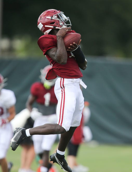 Defensive back Kool-Aid McKinstry (1) intercepts a pass during practice for the Crimson Tide Thursday, Aug. 12, 2021.[Staff Photo/Gary Cosby Jr.]